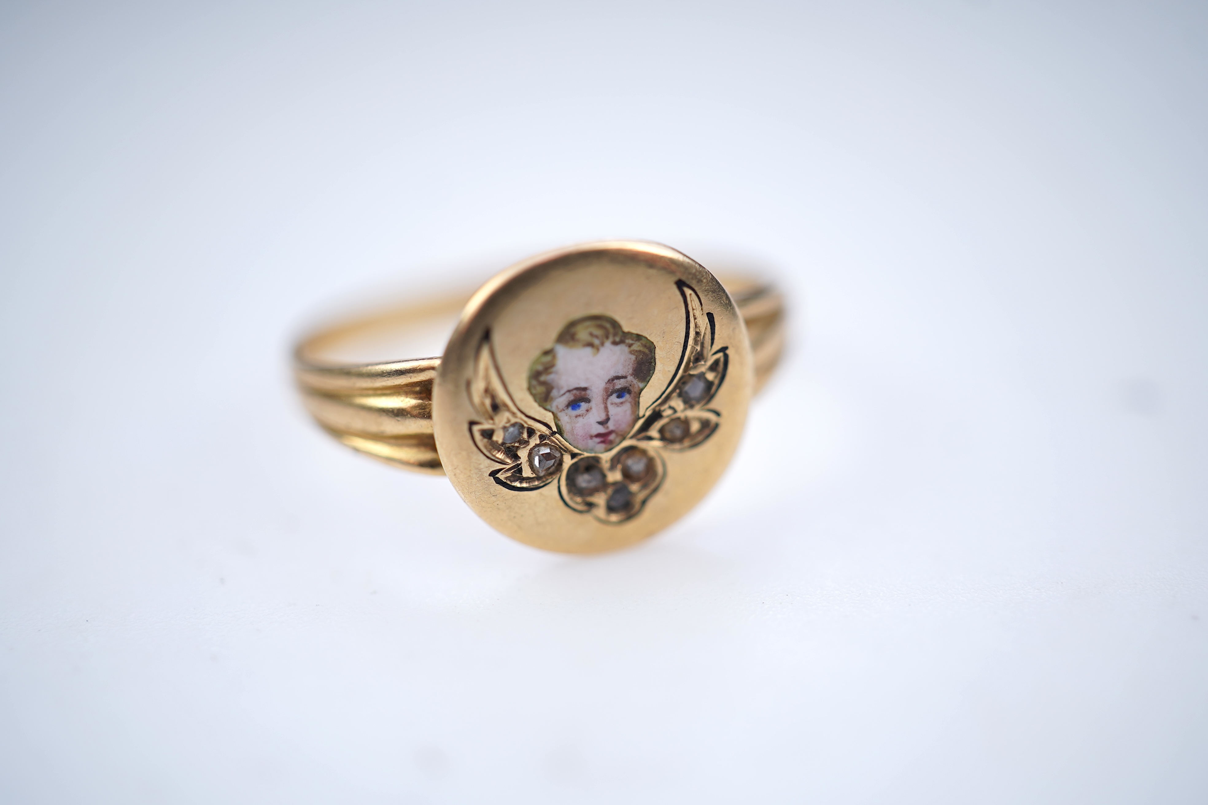 A gold, enamel and diamond signet ring, circa 1900